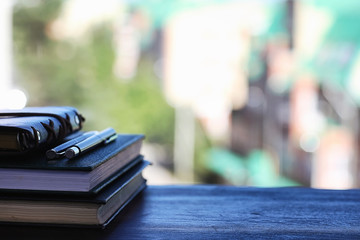 Canvas Print - A stack of textbooks on the windowsill