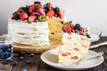 Wall Mural - Rustic Cake With Fresh Berries on a wooden background