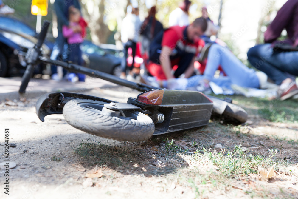 First aid for electric scooter rider injured in an accident Stock Photo ...