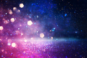 Wall Mural - abstract glitter pink, purple and blue lights background. de-focused