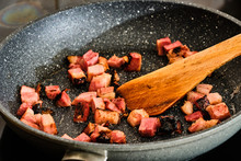 Cooking Bacon Pieces On Frying Pan