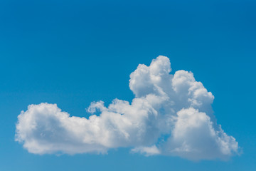 Wall Mural - Single cloud and a blue sky