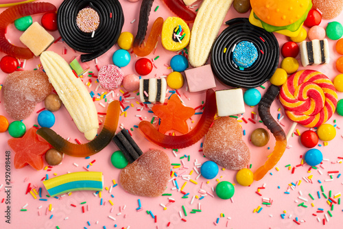 festive background with assortment of colourful caramel candies with jelly, s...