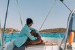 © producer - man relaxing on yacht in the sea. man on board of boat in Greece