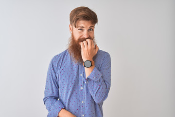 Canvas Print - young redhead irish man wearing casual shirt standing over isolated white background looking stresse