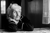 Fototapeta  - Close-up portrait of an elderly meloncholic woman.