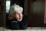 Fototapeta  - Elderly woman at home. Taking care of lonely old pensioners.