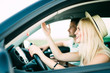 © F8  \ Suport Ukraine - Young angry woman driving car near his boyfriend