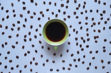 Wall Mural - cup of coffee on the background of coffee beans 