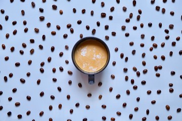 Wall Mural - Cup of coffee on the background of coffee beans 