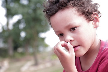 Wall Mural - little boy picking his nose stock image stock photo