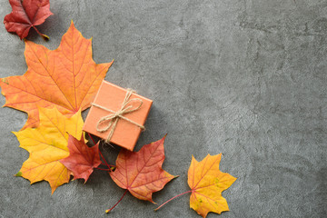 Wall Mural - autumn composition. maple leaves and gift box. flat lay, top view