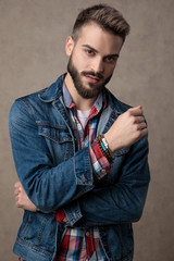 Wall Mural - casual young fashion man wearing blue denim jacket