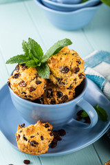 Wall Mural - Fresh homemade delicious raisin muffins in blue cup, sugar free. Healthy food concept.