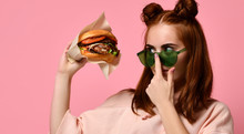 Beautiful Teenage Girl With Red Hair Holding Burger And Beverage In Hand. Ginger Student Girl Has Fast Food Lunch