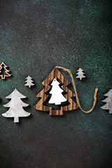 Wall Mural - Overhead shoot of wooden christmas tree and decoration. Winter holidays background with copy space, flat lay, top view.