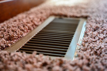 Focus On Floor Vent In Room With Carpet