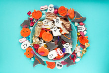 Halloween Jack O Lantern Candy Bowl With Candy And Halloween Cookies Trick Or Treat On Blue Background