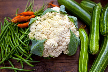 Wall Mural - cauliflower and other vegetables on the wooden board