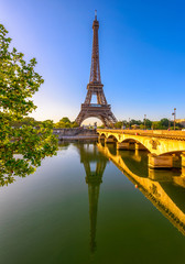 Wall Mural - view of eiffel tower and river seine at sunrise in paris, france. eiffel tower is one of the most ic