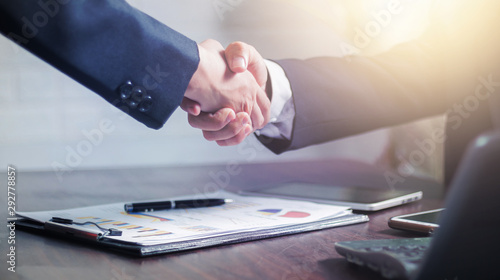 Fotomural successful negotiate and handshake concept, two businessman shake hand with part
