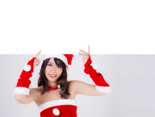 Beautiful Young Asian Santa Woman Holding Blank Board For Xmas Isolated On White Background, Beauty Model Asia Girl Show Empty Banner Paper Poster In Christmas Holiday And New Year For Advertisement.