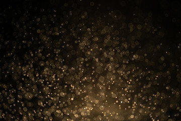 Texture background abstract black and gold Glitter and elegant for Christmas Dust white. Sparkling magical dust particles Magic concept Abstract background with bokeh effect.