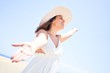© Krakenimages.com - Young beautiful woman sunbathing with open arms enjoying summer vacation at maspalomas dunes beach