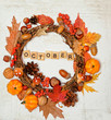 Festive autumn Thanksgiving wreath with pumpkin, fall leaves, red berries, acorns on light background. autumn holiday, fall, thanksgiving, halloween concept. october time. Flat lay, top view