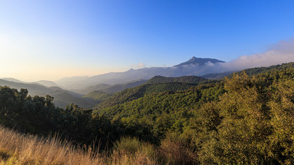 Wall Mural - Foggy Mountain landscape on a blue sunny sky morning in Catalonia Pyrenees