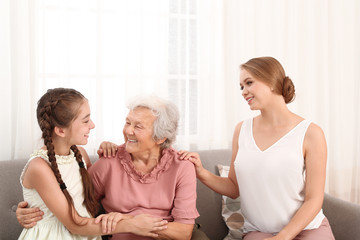 Canvas Print - Happy sisters and their grandmother at home