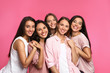 © New Africa - Happy women on pink background. Girl power concept