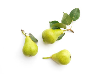 Green pears with leaves isolated on white background, top view