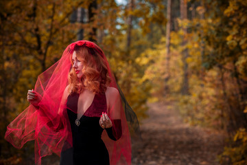 Wall Mural - Magical time, Autumn bride with red veil . Costume and ideas for party, ladys witchcraft  