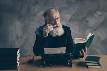 Portrait Of His He Nice Attractive Content Dreamy Bearded Gray-haired Professional Expert Publisher Reading Interesting Diary Life Story Novel Over Concrete Wall Background