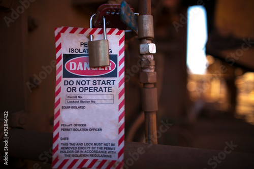 Danger permit isolation tag do not start or operate and locking to control life plant starting up, protection the risk of hazard at construction mine site, Perth western of Australia