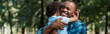 © LIGHTFIELD STUDIOS - panoramic shot of happy african american father hugging son