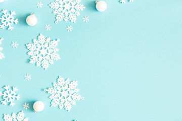 Christmas or winter composition. Pattern made of snowflakes on pastel blue background. Christmas, winter, new year concept. Flat lay, top view, copy space