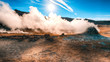 Steaming cone in Hverir geothermal area with boiling mudpools and steaming fumaroles in Iceland