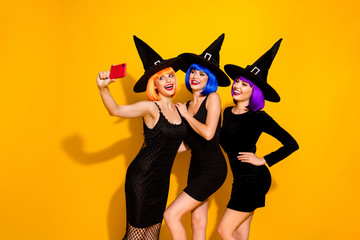 Sticker - Live broadcasting from theme party. Photo of three friendly charming magic fantasy fairy mysterious cool in caps ladies making selfie isolated vivid color background