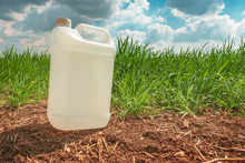 Blank Pesticide Jug Container Mock Up In Wheatgrass Field