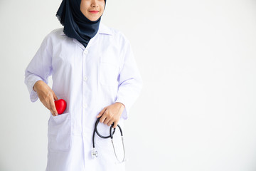 Wall Mural - Young Arab Muslim intern doctor women smile on isolate white background concept for Islam people working in medical hospital health care, Modern Nurse wearing hijab in medico clinic business service.