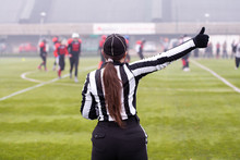 Rear View Of Female American Football Referee