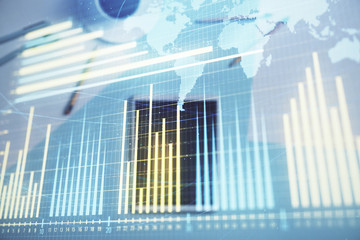 Double exposure of forex chart and world map on digital tablet laying on table background. Concept of market analysis