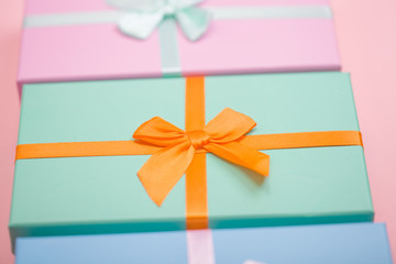 Sticker - multi-colored boxes with bows on a pink background