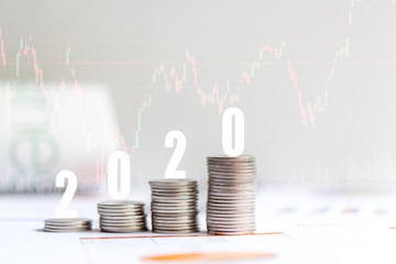 2020 New year on growing up money coin stack for investment.  Economic and business growth in 2020, planning financial report for investor real estate business