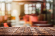 © bunditinay - Empty wood table top and blurred coffee shop and restaurent interior background - can used for display or montage your products.