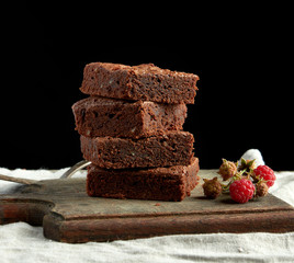 Wall Mural - stack of baked square pieces of chocolate brownie cake