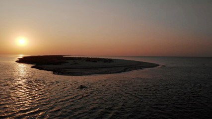 Amazing sea sunset. Beautiful waving sea under sunset sky. Picturesque summer scene.