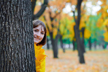 Teen Girl Posing With Autumn Leaves In City Park, Outdoor Portrait